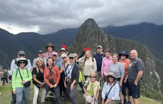 Group at Machu Picchu summit on Peru journey